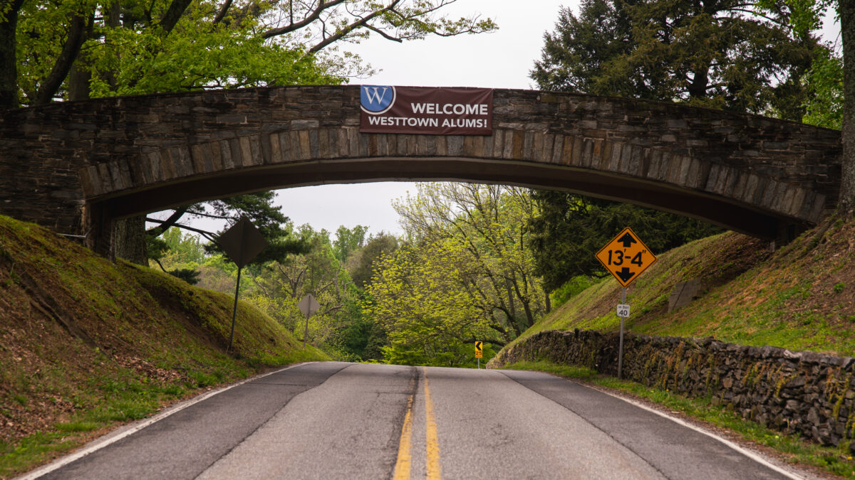 Alum welcome banner on bridge