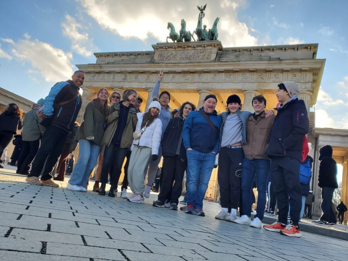 Students standing in front of Brandenburg Gate in Berlin, Germany