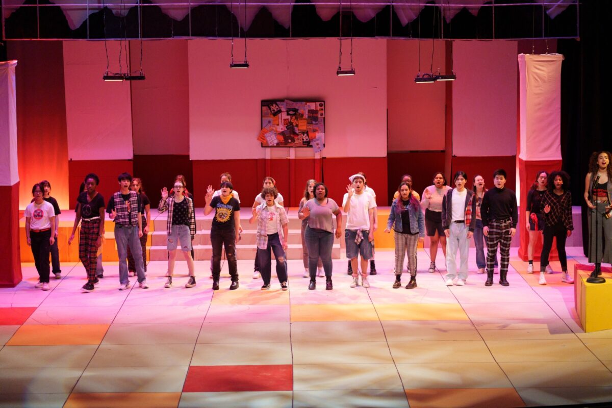 students performing on stage