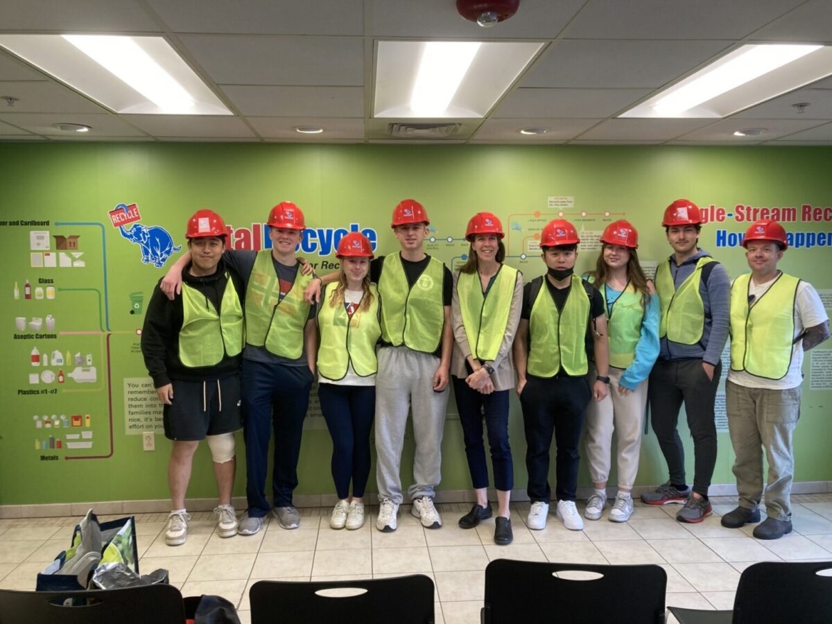 upper school students wearing hardhats and reflective vests