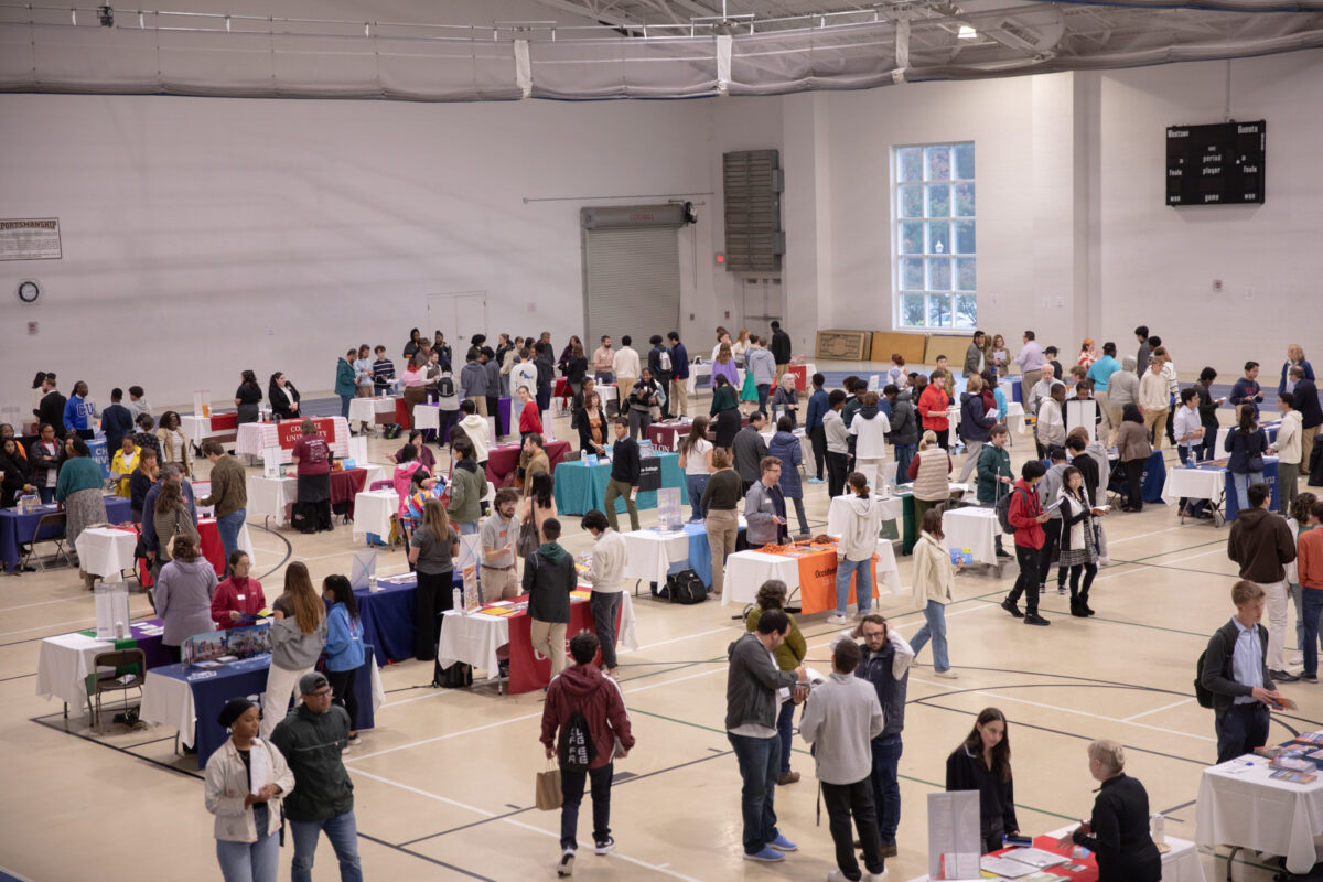 People browsing booths set up at the fair